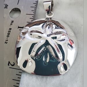 Sterling silver sand dollar pendant